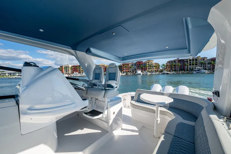 Karey Lee Yacht Photos Pics Luxurious 2024 Intrepid 477 Evolution yacht interior with waterfront view.