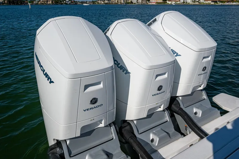 Karey Lee Yacht Photos Pics Triple Mercury Verado outboard engines on 2024 Intrepid 477 Evolution boat, docked on water.