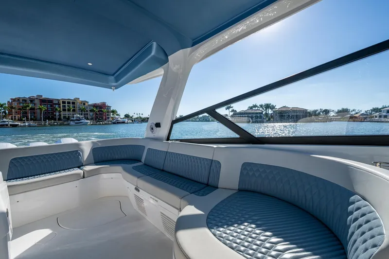 Karey Lee Yacht Photos Pics Luxurious interior of 2024 Intrepid 477 Evolution yacht with waterfront view.