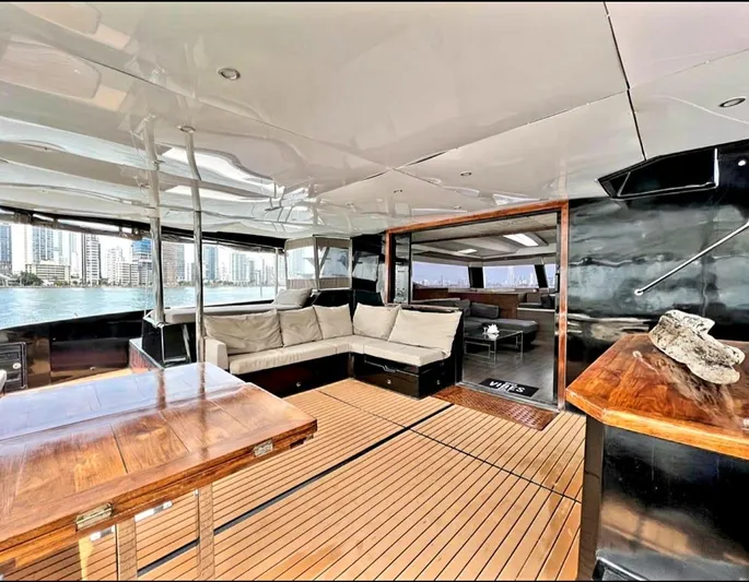 Octopus Yacht Photos Pics 2017 Fountaine Pajot Ipanema 58 Power Catamaran interior with spacious seating and wooden accents.