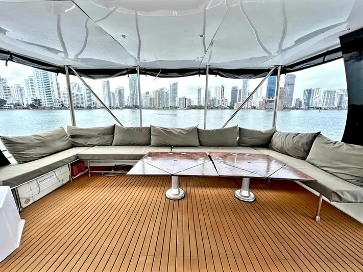 Octopus Yacht Photos Pics 2017 Fountaine Pajot Ipanema 58 Power Catamaran with spacious deck and city skyline view.