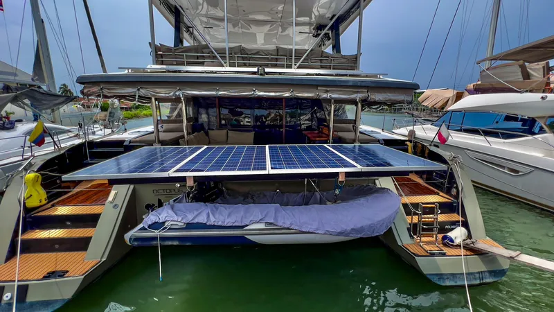 Octopus Yacht Photos Pics 2017 Fountaine Pajot Ipanema 58 Power Catamaran with solar panels docked at marina.