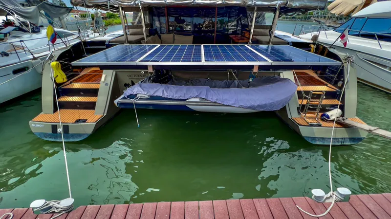 Octopus Yacht Photos Pics 2017 Fountaine Pajot Ipanema 58 Power Catamaran with solar panels docked at marina.