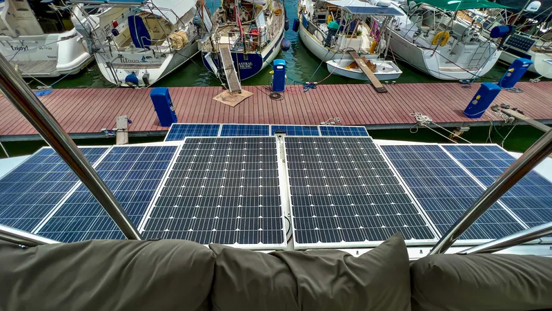 Octopus Yacht Photos Pics 2017 Fountaine Pajot Ipanema 58 Power Catamaran with solar panels docked at marina.