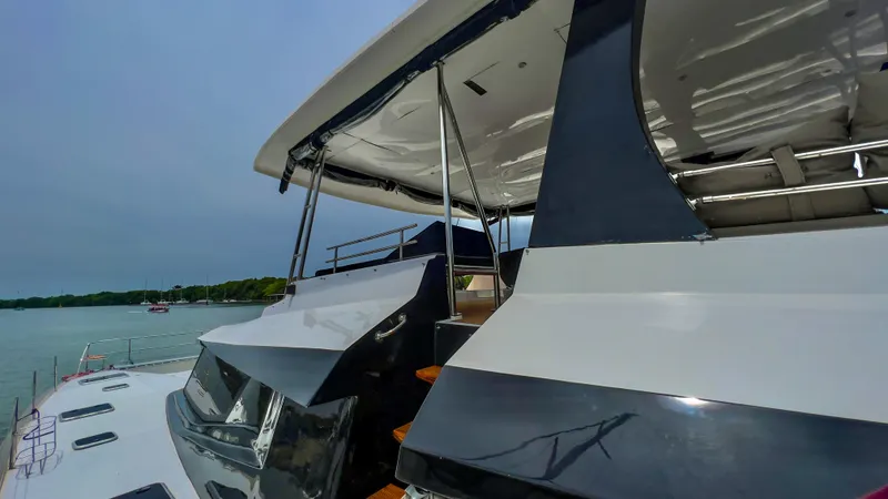 Octopus Yacht Photos Pics 2017 Fountaine Pajot Ipanema 58 Power Catamaran docked near the shore.