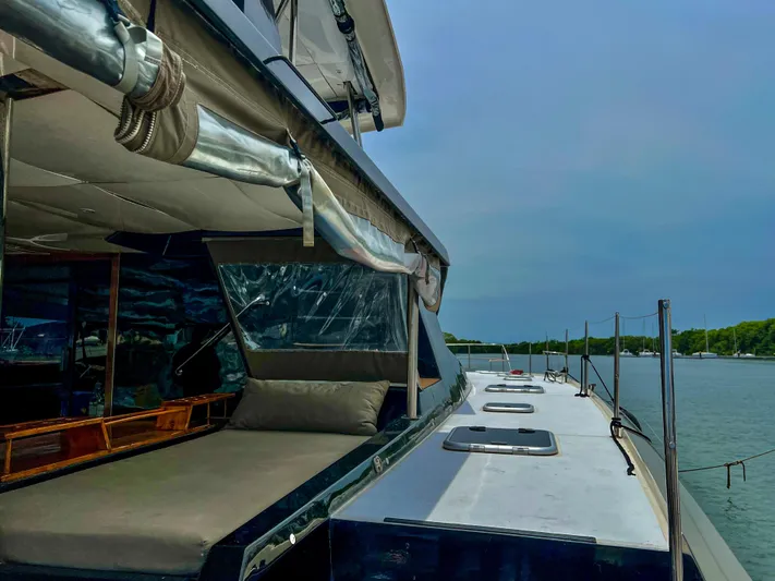 Octopus Yacht Photos Pics 2017 Fountaine Pajot Ipanema 58 Power Catamaran docked by the water.