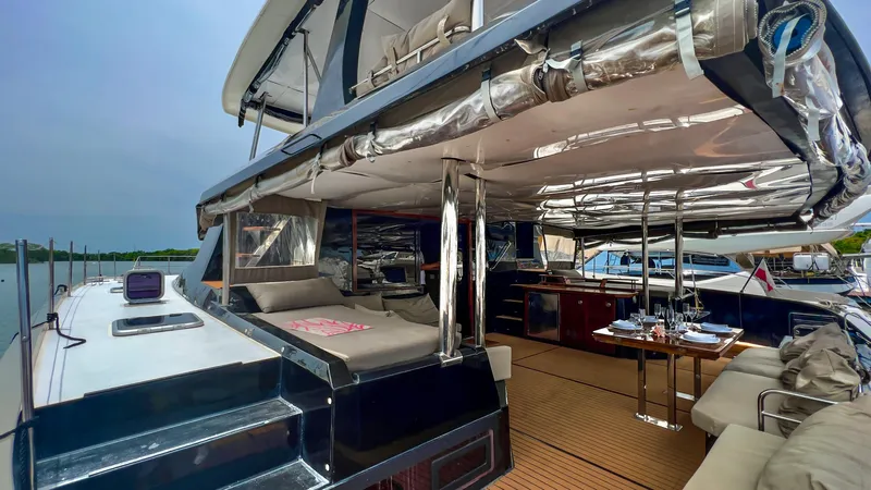 Octopus Yacht Photos Pics 2017 Fountaine Pajot Ipanema 58 Power Catamaran, spacious deck with seating and dining area.