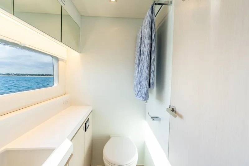  Yacht Photos Pics Modern yacht bathroom with ocean view, featuring sleek design and towel rack. Two Oceans 555 - 008, 2025.