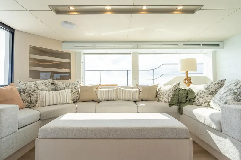  Yacht Photos Pics Luxurious yacht interior with plush seating, decorative pillows, and modern lighting, Two Oceans 555 - 008, 2025.