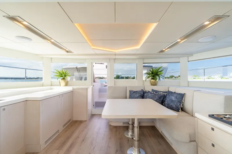  Yacht Photos Pics Luxurious interior of 2025 Two Oceans 555 - 008 yacht with modern decor and seating.