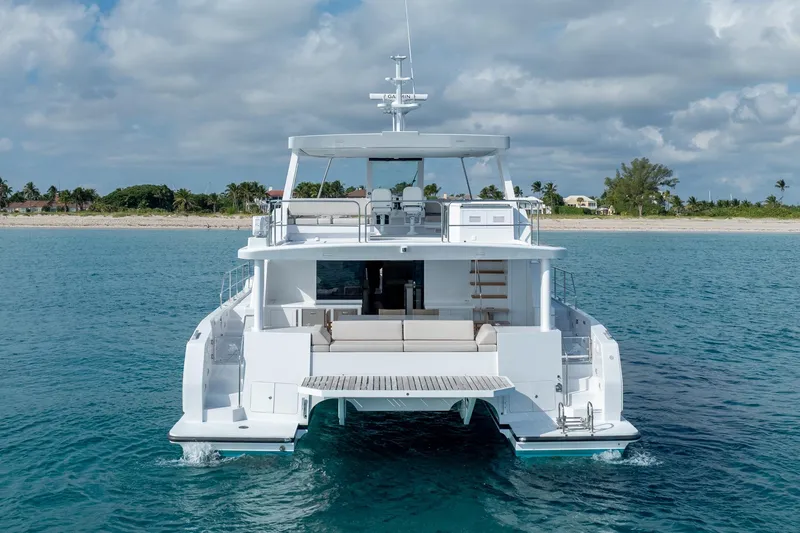  Yacht Photos Pics Luxury Two Oceans 555 - 008 yacht cruising near tropical shoreline, 2025 model.