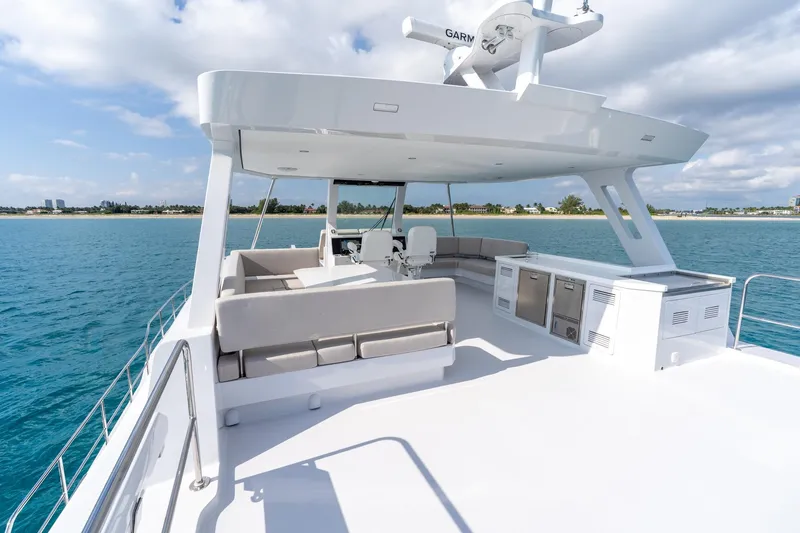 Yacht Photos Pics Luxurious 2025 Two Oceans 555-008 yacht deck with seating, ocean view, and modern amenities.