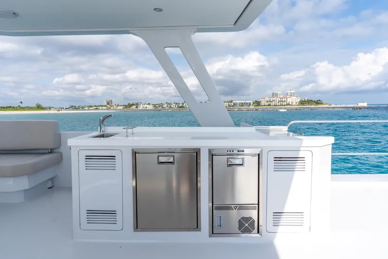  Yacht Photos Pics Luxury yacht deck with modern kitchenette, Two Oceans 555 - 008, 2025 model, ocean view.