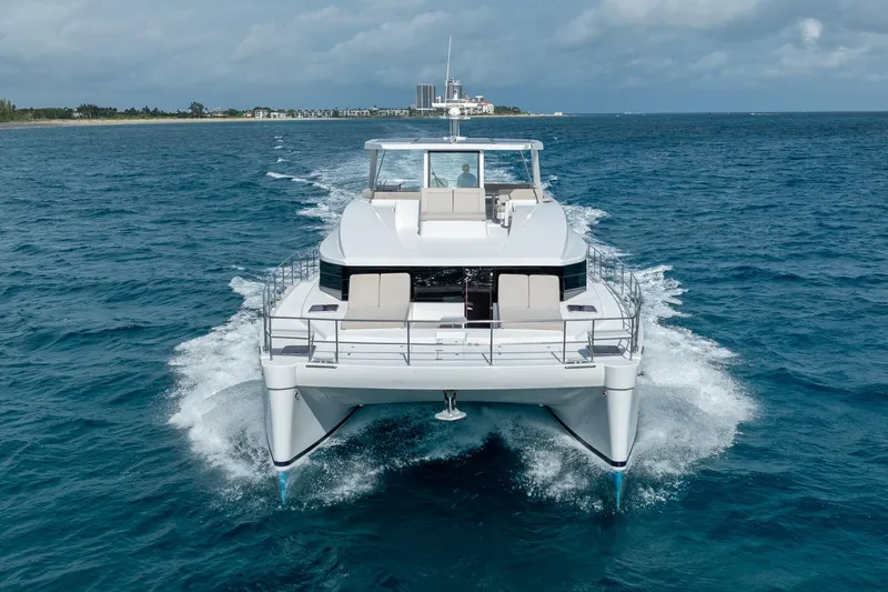  Yacht Photos Pics Luxury Two Oceans 555 - 008 catamaran cruising on open sea, 2025 model.