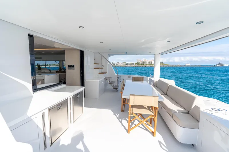  Yacht Photos Pics Luxurious 2025 Two Oceans 555 - 008 yacht deck with dining area and ocean view.