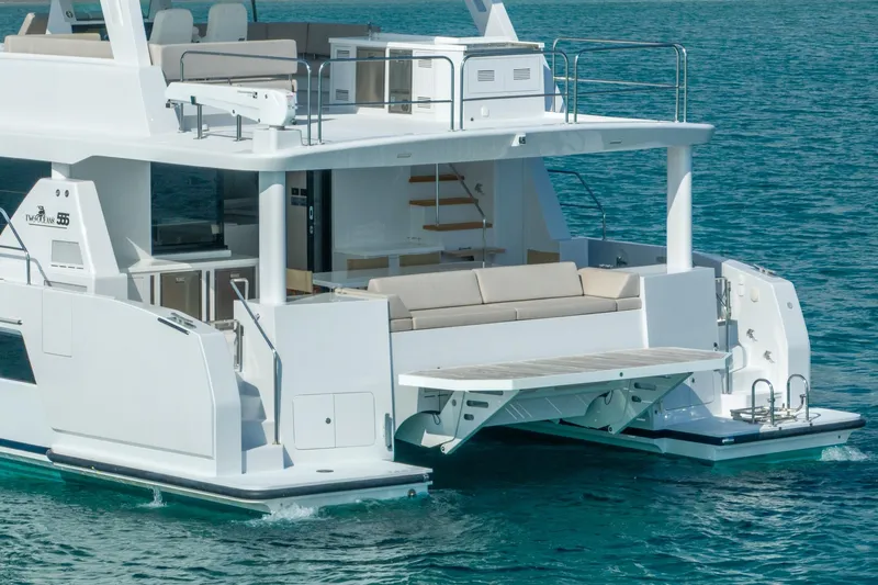  Yacht Photos Pics Luxury Two Oceans 555 yacht, 2025 model, featuring spacious deck and modern design on clear water.