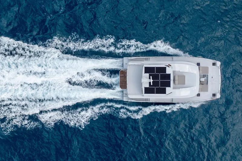  Yacht Photos Pics Aerial view of Two Oceans 555 - 008 yacht with solar panels, cruising in blue ocean, 2025 model.