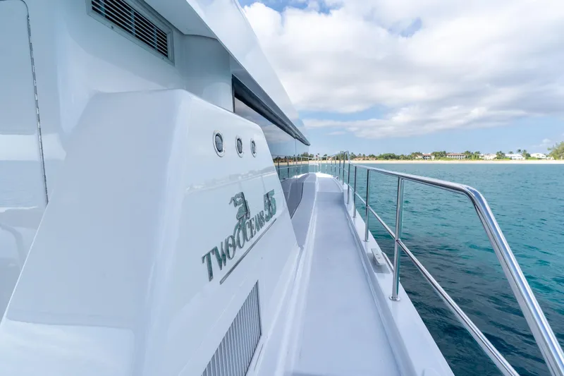  Yacht Photos Pics Luxury yacht "Two Oceans 555 - 008" cruising near a scenic coastline, 2025 model.