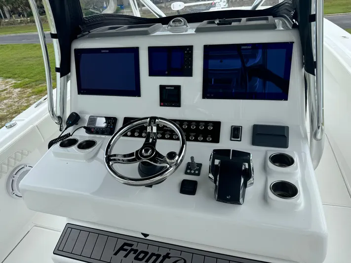  Yacht Photos Pics 2023 Front Runner 36 Center Console boat dashboard with steering wheel and electronic displays.