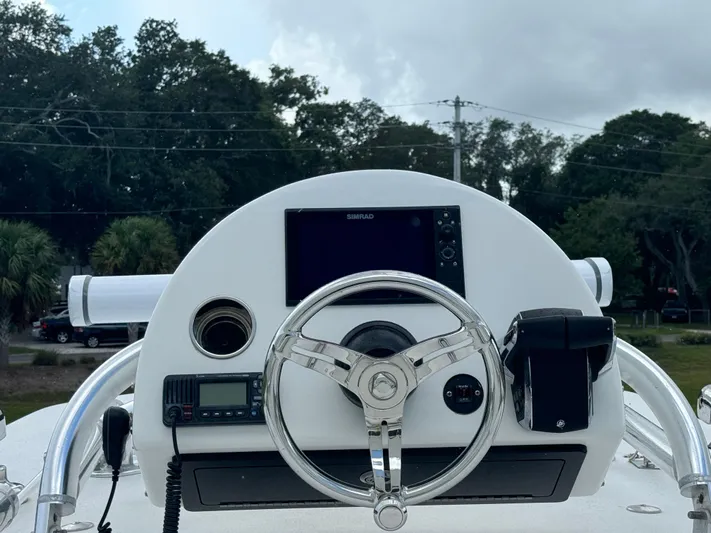  Yacht Photos Pics 2023 Front Runner 36 Center Console helm with steering wheel and navigation equipment.