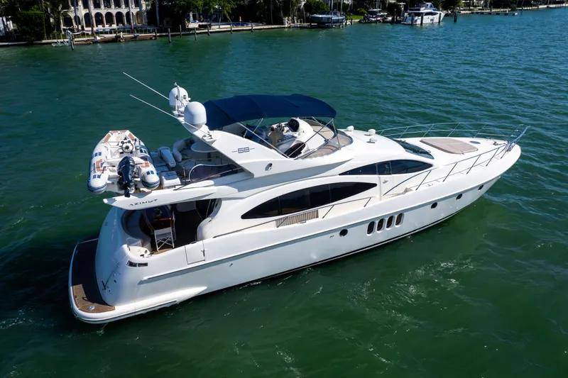 Freedom Yacht Photos Pics Luxury 2005 Azimut 68 yacht cruising on clear blue water.