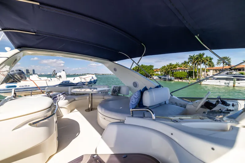 Freedom Yacht Photos Pics Luxurious 2005 Azimut 68 yacht interior with ocean view and elegant seating.