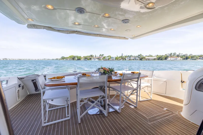 Freedom Yacht Photos Pics Luxury dining area on 2005 Azimut 68 yacht with ocean view.