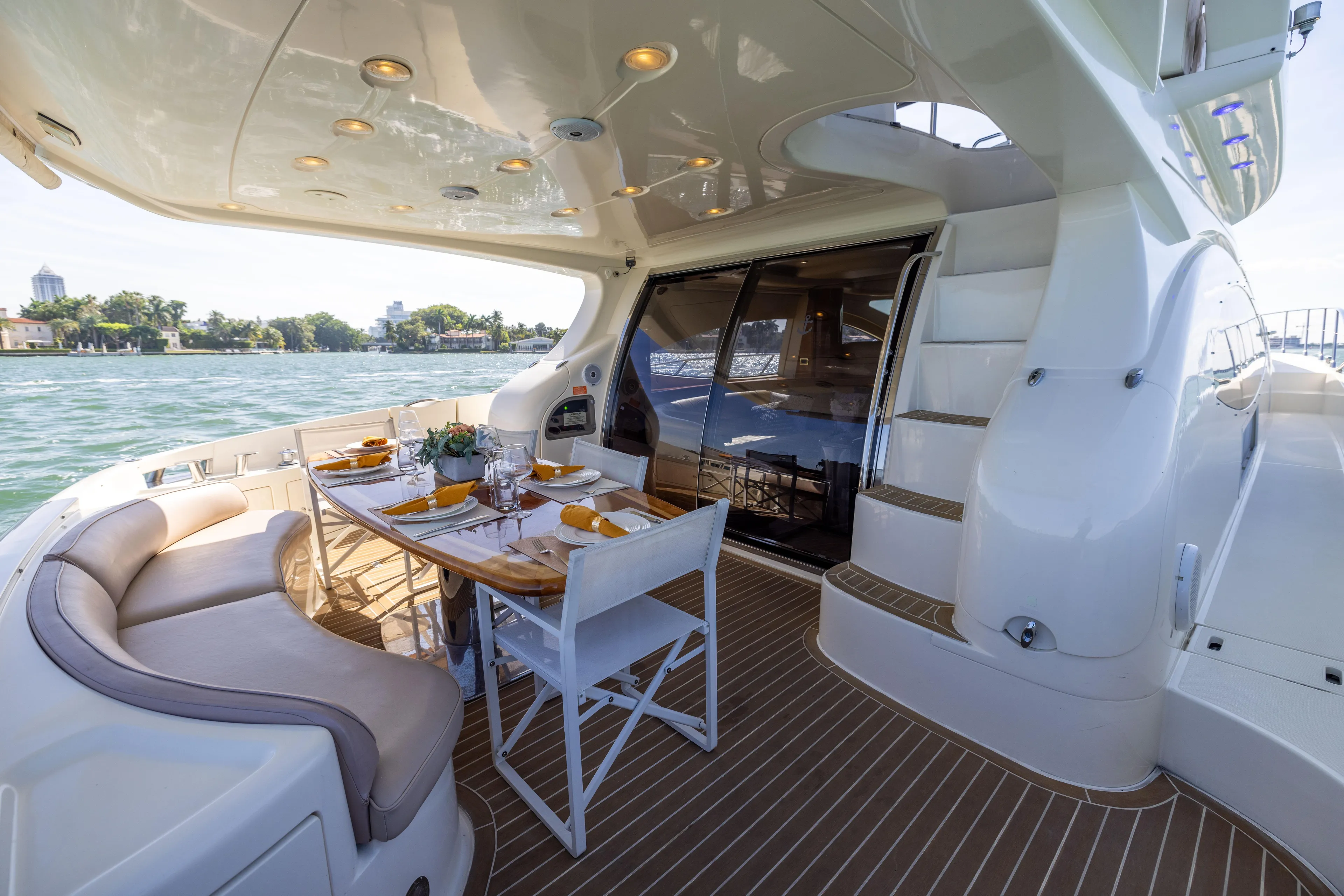 Freedom Yacht Photos Pics Luxurious 2005 Azimut 68 yacht deck with elegant dining setup and scenic water view.