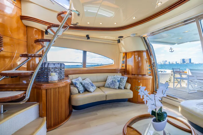 Freedom Yacht Photos Pics Luxurious interior of 2005 Azimut 68 yacht with elegant seating and scenic ocean view.