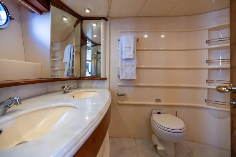 Freedom Yacht Photos Pics Luxurious bathroom in a 2005 Azimut 68 yacht with dual sinks and elegant fixtures.