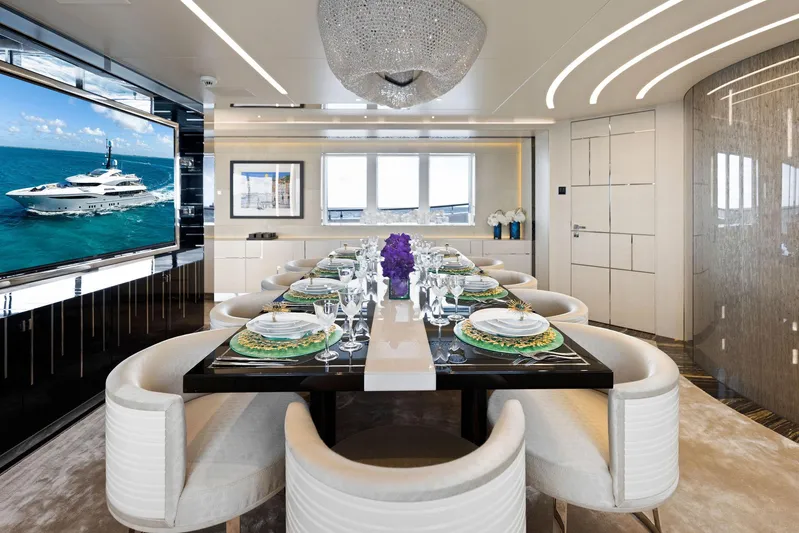 Moonraker Yacht Photos Pics Luxurious dining area on Bilgin 156 yacht, featuring elegant table setting and modern decor.