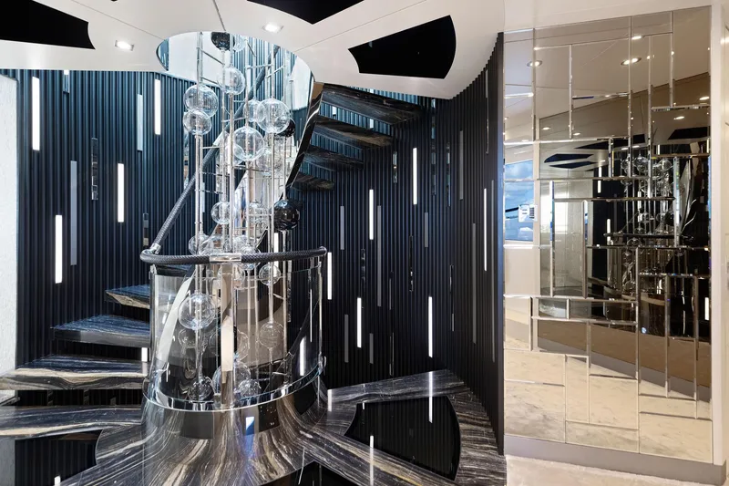 Moonraker Yacht Photos Pics Luxurious interior of 2019 Bilgin 156 yacht with modern staircase and elegant lighting.