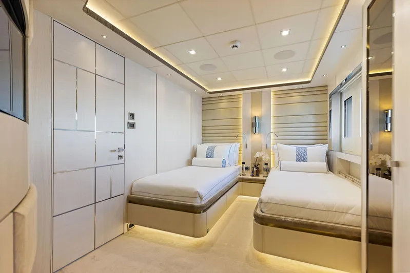 Moonraker Yacht Photos Pics Luxurious Bilgin 156 yacht bedroom interior with twin beds, modern lighting, and elegant decor.