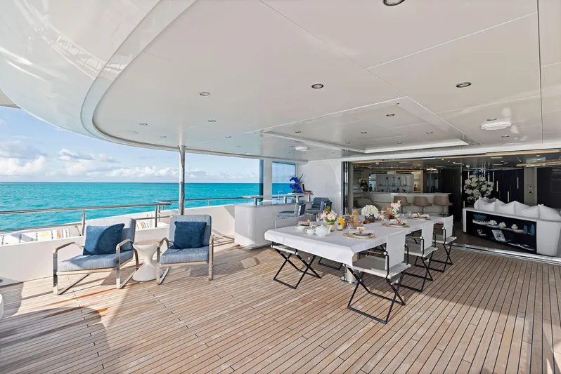 Moonraker Yacht Photos Pics Luxurious Bilgin 156 yacht deck with dining area, ocean view, and elegant seating, 2019 model.