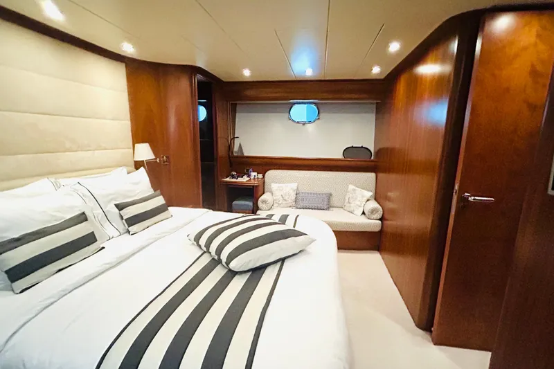  Yacht Photos Pics Luxurious cabin interior of 2004 Canados 72s yacht with elegant bedding and wood finishes.