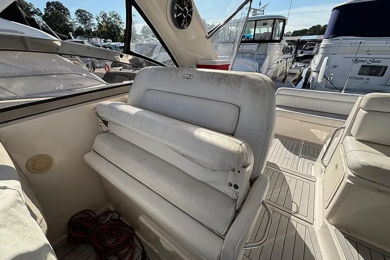  Yacht Photos Pics 2005 Regal Commodore 4260 boat interior with white seating and marina view.