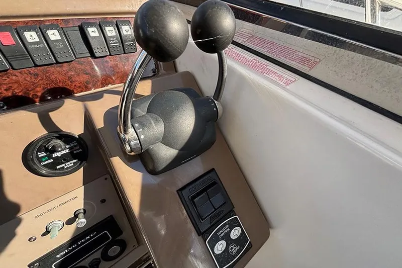  Yacht Photos Pics Control panel of a 2005 Regal Commodore 4260 boat with throttle levers.