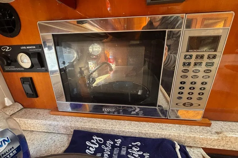  Yacht Photos Pics Microwave oven inside 2005 Regal Commodore 4260 yacht kitchen area.