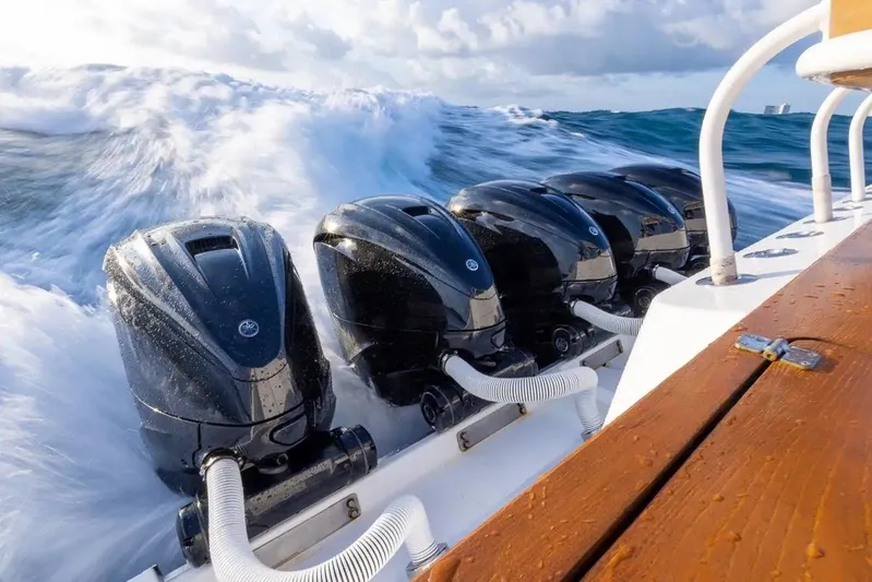 Next To Sell Yacht Photos Pics 2020 HCB Estrella boat with powerful outboard engines navigating rough seas.