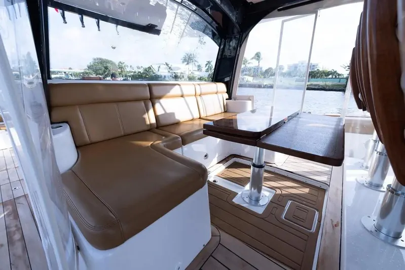Next To Sell Yacht Photos Pics Luxurious seating area on a 2020 HCB Estrella boat with a wooden table.