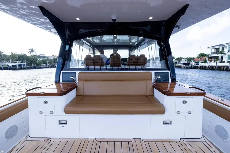 Next To Sell Yacht Photos Pics HCB Estrella 2020 boat interior with brown seating and waterfront view.