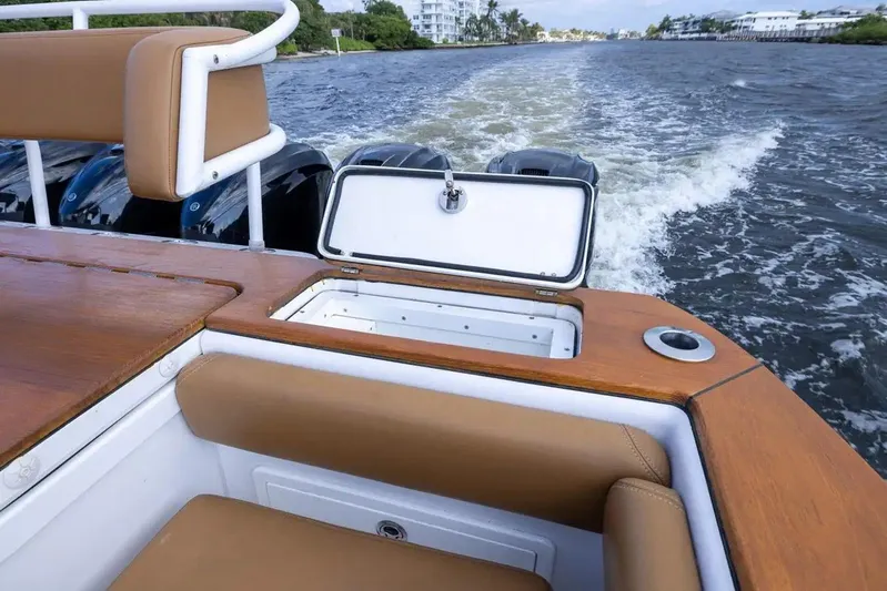 Next To Sell Yacht Photos Pics 2020 HCB Estrella boat interior with open storage compartment on water.