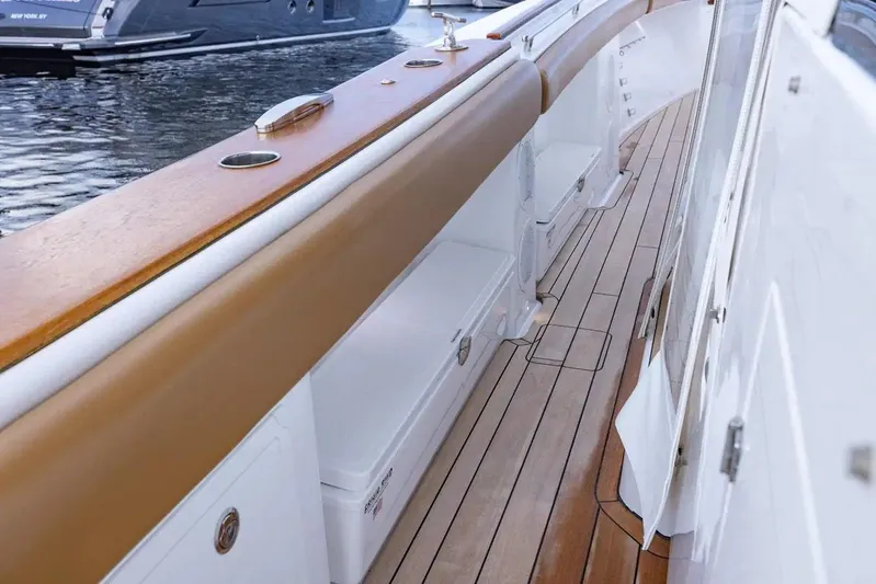 Next To Sell Yacht Photos Pics 2020 HCB Estrella boat deck with teak flooring and white storage compartments.
