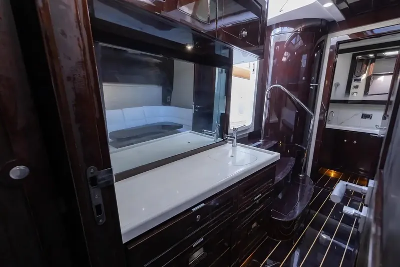 Next To Sell Yacht Photos Pics Luxurious bathroom interior of 2020 HCB Estrella yacht with modern fixtures and dark wood finishes.