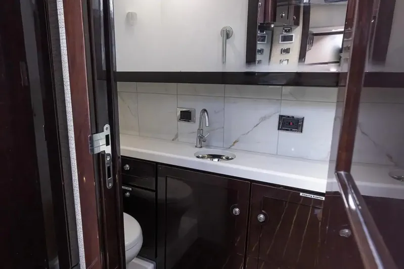 Next To Sell Yacht Photos Pics Luxurious bathroom in 2020 HCB Estrella yacht with modern fixtures and dark wood cabinetry.