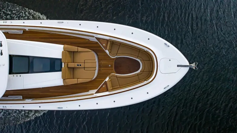 Next To Sell Yacht Photos Pics Top view of 2020 HCB Estrella yacht with luxurious seating and wooden deck.