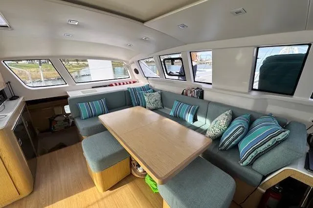 Swell Yacht Photos Pics Interior of 2021 Outremer 51 catamaran with spacious seating and modern design.