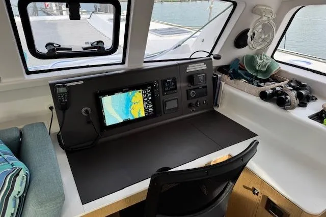 Swell Yacht Photos Pics Navigation station inside 2021 Outremer 51 catamaran with chart plotter and equipment.