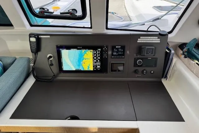 Swell Yacht Photos Pics Navigation station of 2021 Outremer 51 catamaran with chart plotter and communication equipment.