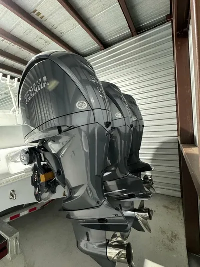 36 Yellowfin Yacht Photos Pics 2024 Yellowfin 36 boat with triple outboard engines in storage.